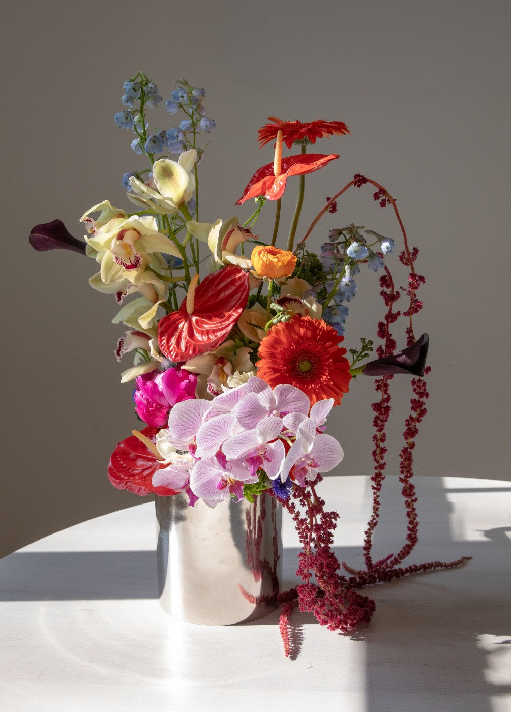 Wedding arrangement of garden roses, ranunculus and lisianthus
